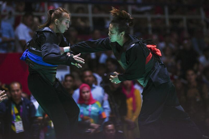 Vietnam's Tran Thi Them competes against Indonesia's Wewey Wita during the pencak silat women's class 50kg to 55kg final at the 2018 Asian Games at Jakarta. AFP