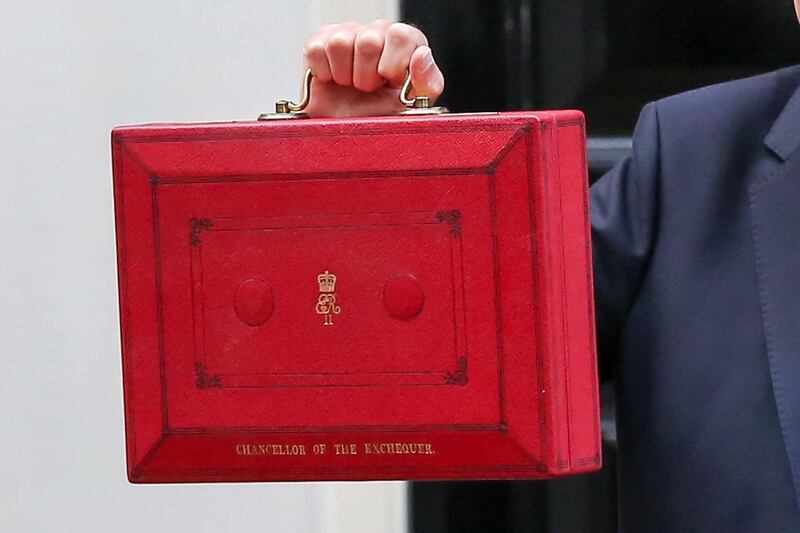 LONDON, UNITED KINGDOM - 2018/10/29: Chancellor of the Exchequer, Philip Hammond seen holding a famous red box on the steps of Number 11 Downing street, before leaving for the Palace of Westminster to deliver the budget to the House of Commons. (Photo by Dinendra Haria/SOPA Images/LightRocket via Getty Images)