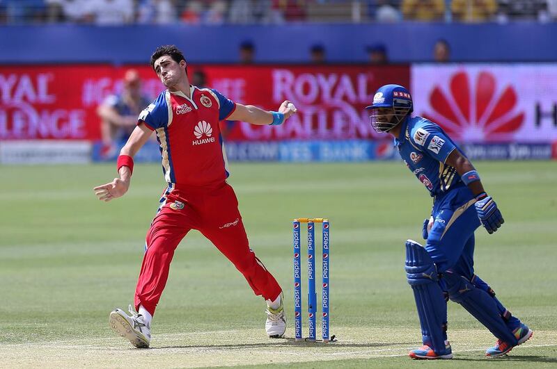 Mitchell Starc, the Australian fast bowler, opened the bowling for Royal Challengers Bangalore. But Mumbai Indians, their opponents for the afternoon, got off to a decent start with Aditya Tare, right, and Mike Hussey keeping the scoring ticking. Pawan Singh / The National