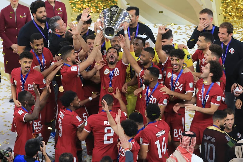 Qatar's team lift the trophy after winning the AFC Asian Cup final against Jordan. AP