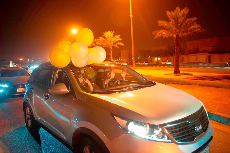 A Saudi woman and her friends celebrate her first time driving on a main street of Khobar City. Hussain Radwan / AFP