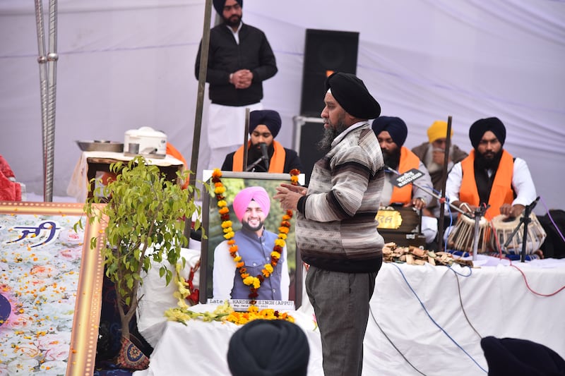 A large photograph of Mr Singh is displayed during the ceremony. Prabhjot Singh Gill for The National