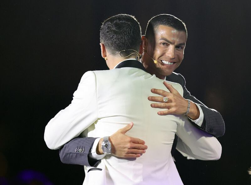 Cristiano Ronaldo embraces Player of the Year award winner Robert Lewandowski. Reuters