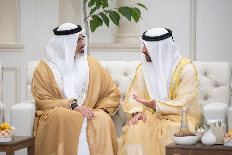 Sheikh Khaled bin Mohamed exchanges greetings with Sheikh Hamdan bin Mohammed.