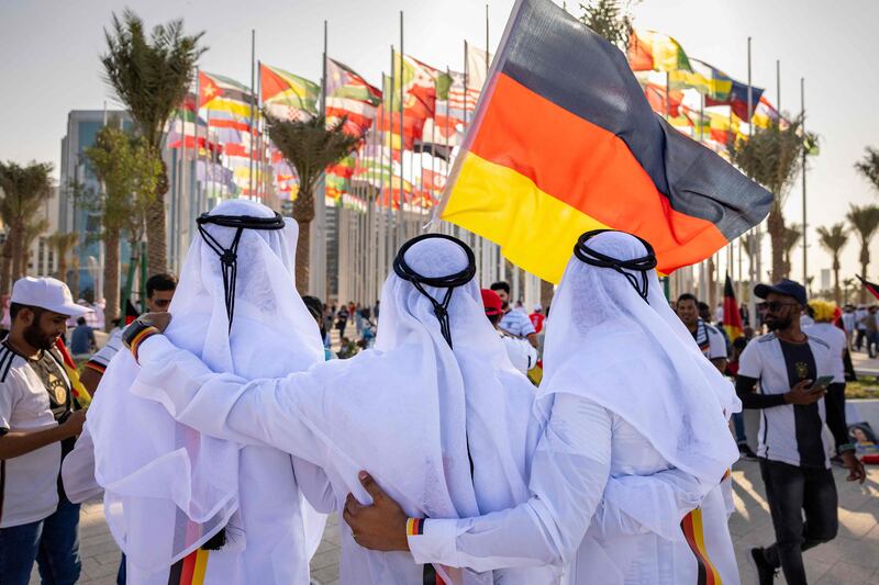 Football fans supporting Germany cheer in Doha, ahead of the Qatar 2022 FIFA World Cup football tournament.  AFP