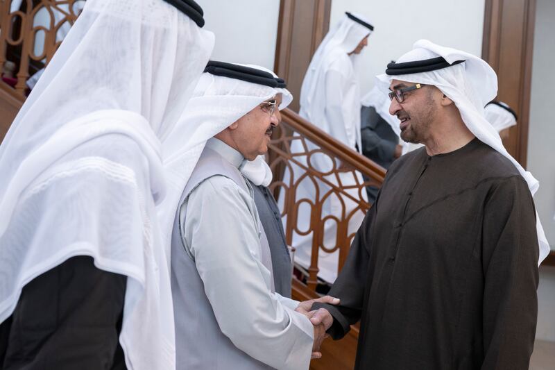 Sheikh Mohamed greets a member of the Bahraini delegation after arriving at Sakhir Airbase. Hamad Al Kaabi / UAE Presidential Court 
