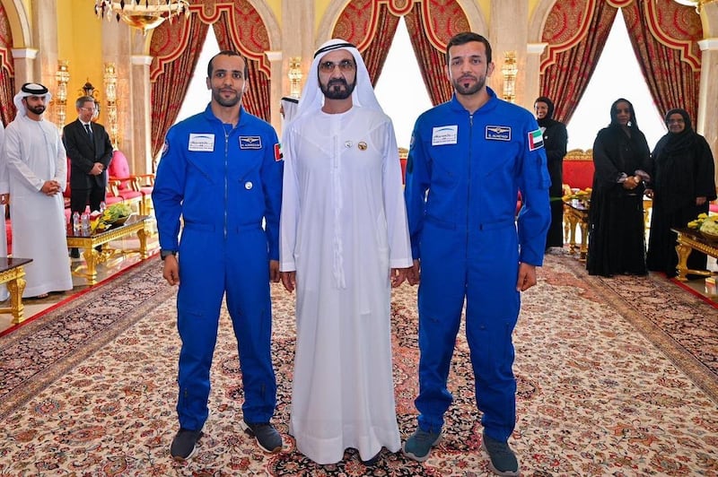 Sheikh Mohammed bin Rashid, the Vice President and Ruler of Dubai, is flanked by Hazza Al Mansouri, left, and Sultan Al Neyadi, right. Sheikh Mohammed bin Rashid Twitter