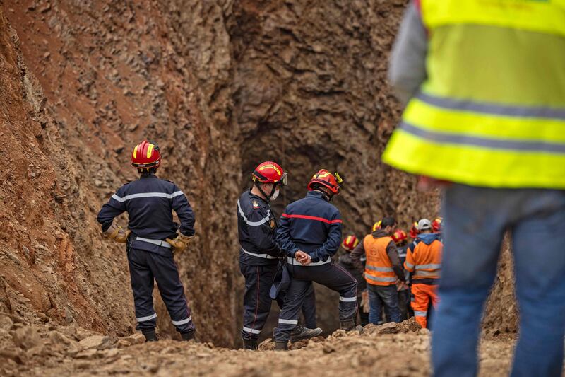 Rescuers during the nerve-racking final stages of a marathon effort to rescue Rayan. AFP