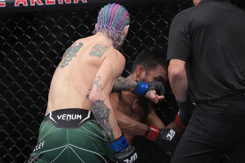 Sean O'Malley punches Raulian Paiva. Reuters