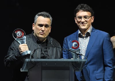 CinemaCon Directors of the Year Award recipients for "Avengers: End Game" Anthony Russo (R) and Joe Russo (L) speak on stage for the 2019 Big Screen Achievement Awards at The Colosseum at Caesars Palace in Las Vegas on April 4, 2019.  / AFP / VALERIE MACON
