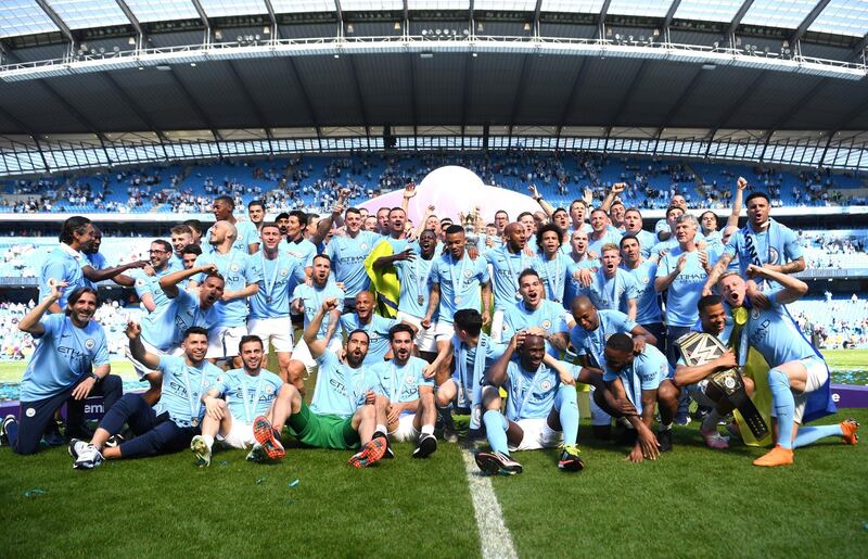 Manchester City celebrate winning the Premier League title. Michael Regan / Getty Images
