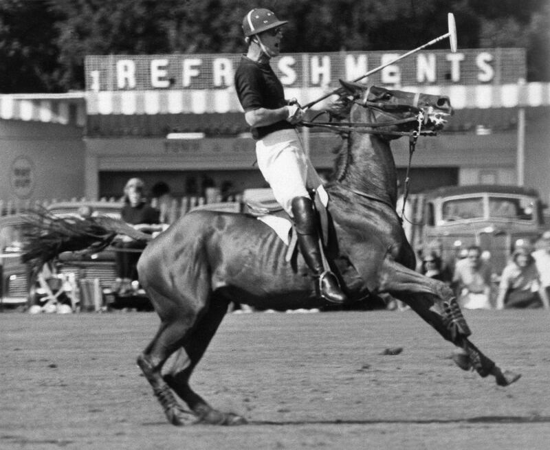 Britain's Prince Philip pulls his mount up sharp during a polo match at Windsor, England, in 1965. AP Photo