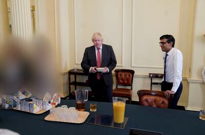 Boris Johnson and Chancellor of the Exchequer Rishi Sunak in the Cabinet room at No 10 Downing Street marking the Prime Minister's birthday on June 19, 2020. Reuters