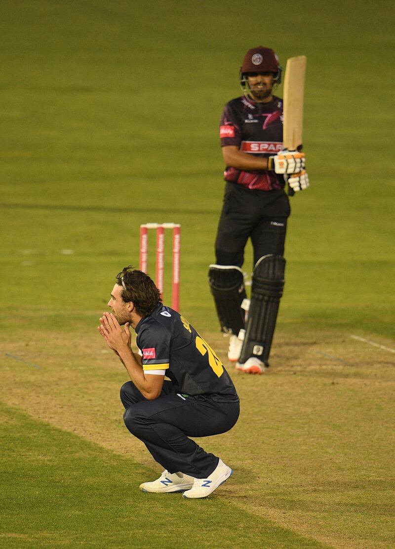 Ruaidhri Smith of Glamorgan reacts as Babar Azam is dropped. Getty