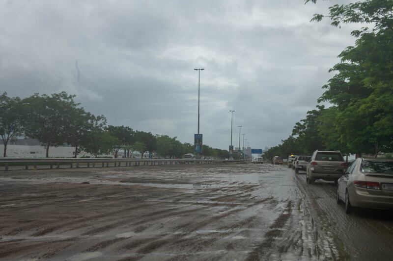 Cars navigate flooded roads in Fujairah. Issa Alkindy/The National