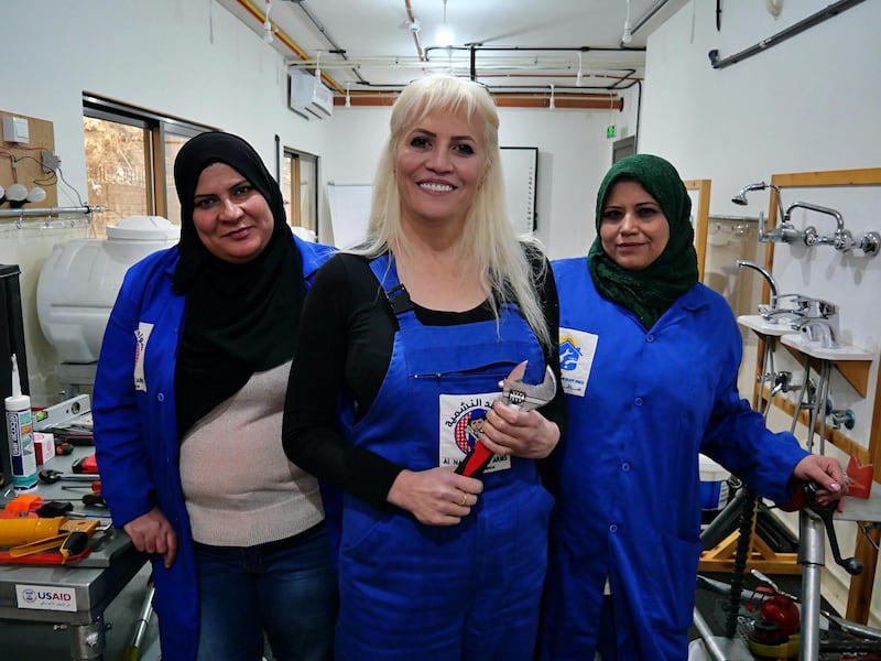 Pictured: Female plumbers Khawla Al-Sheikh (centre), Aisha Amayrah (left) and Rehab Hamzeh (right) stand in their training centre in Amman, Jordan.
20/01/2020
Picture by Charlie Faulkner