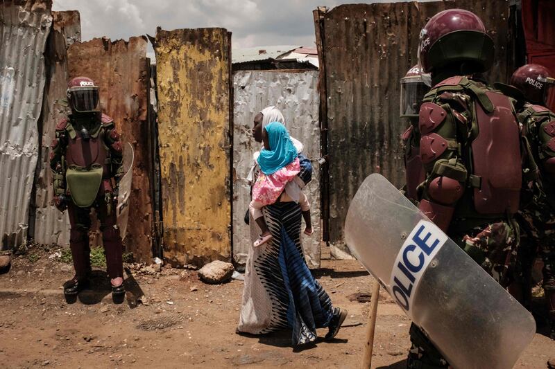 Police block a street during a rally called by opposition leader Raila Odinga, who claims the Kenyan presidential election was stolen from him, in Kibera, Nairobi. AFP