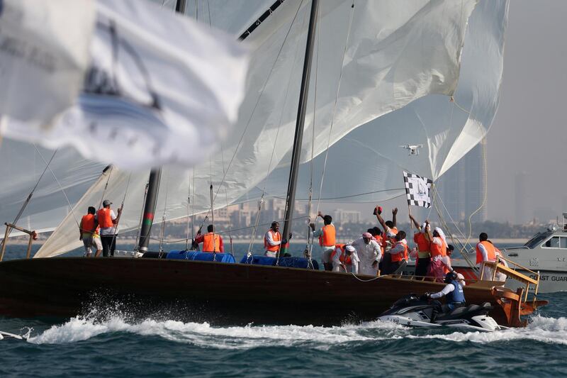 Emirati team celebrate their winning of the 29th annual dhow sailing race, known as Al Gaffal, at the finish line in Dubai.  AFP