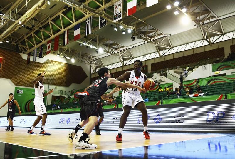 Caleb Swanigan, right, of the United States competes for the ball with Hiroto Gunji of Japan during their Fiba Under 17 World Championships game at Al Shabab Club on August 12, 2014, in Dubai. Francois Nel / Getty Images