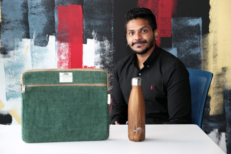 Sooraj Das, founder and chief executive of Hybrid Hippie with a hemp-based laptop cover and recyclable water bottle. Pawan Singh/The National