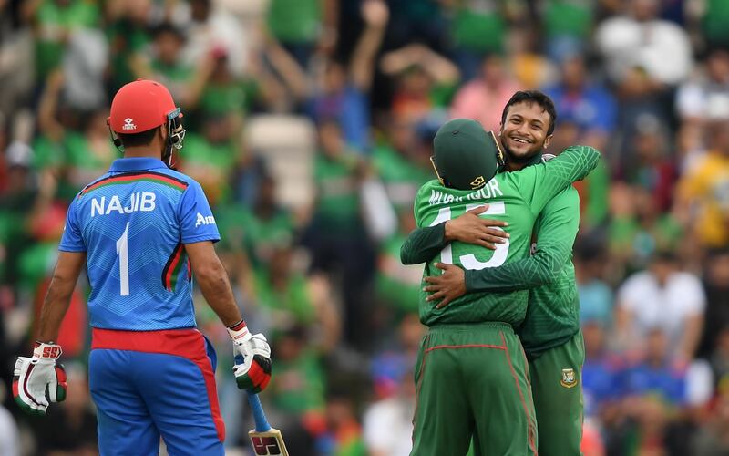 SOUTHAMPTON, ENGLAND - JUNE 24: Shakib Al Hasan of Bangladesh celebrates taking the wicket of Najibullah Zadran of Afghanistan with Mushfiqur Rahim of Bangladesh during the Group Stage match of the ICC Cricket World Cup 2019 between Bangladesh and South Africa at The Hampshire Bowl on June 24, 2019 in Southampton, England. (Photo by Alex Davidson/Getty Images)