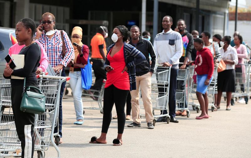 People queue to shop ahead of a nationwide 21-day lockdown called by the government to limit the spread of coronavirus disease (COVID-19) in Harare, Zimbabwe. REUTERS