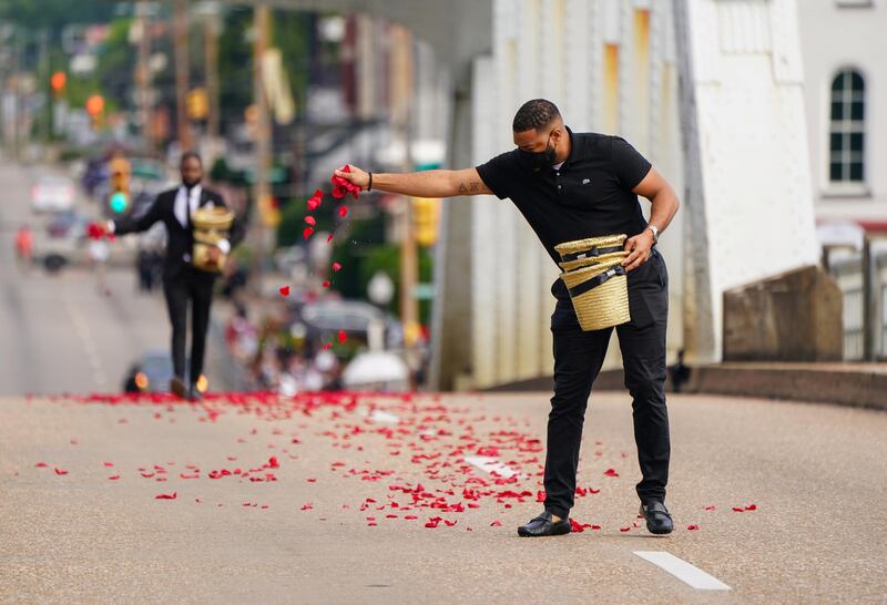The rose petals represent the blood Lewis spilled on the bridge on 'Bloody Sunday' in 1965. Reuters