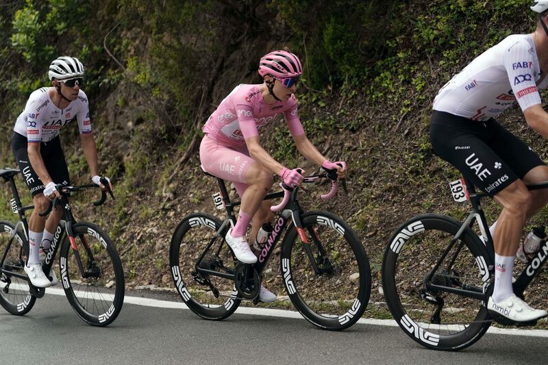 UAE Team Emirates rider Tadej Pogacar, wearing the pink jersey of the overall race leader, in the peloton during Stage 5. AP