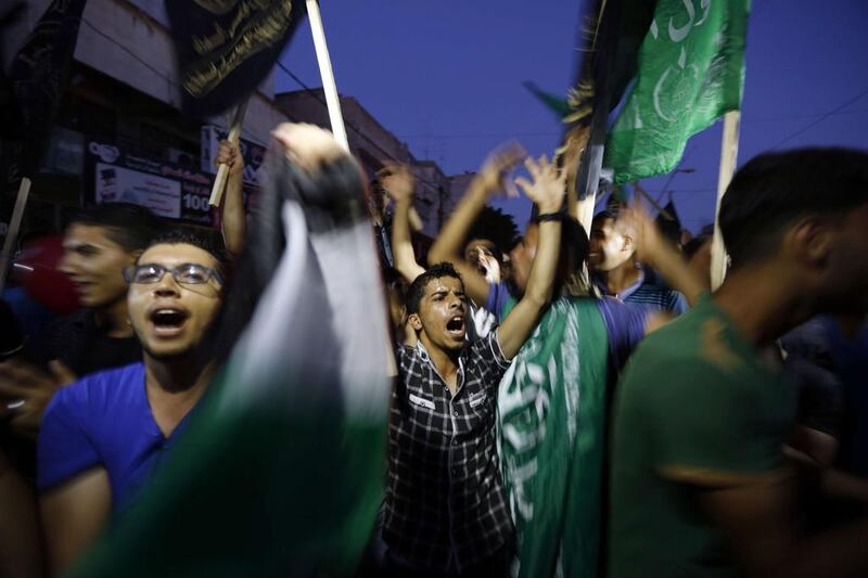 As the truce went into effect, hordes of people surged onto the streets, clapping and chanting songs of victory. Mohammed Abed/ AFP Photo