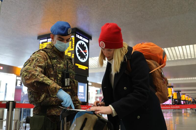 An Italian Army officer from the 66° Reggimento Fanteria Aeromobile "Trieste" checks a passenger at the Rome Termini railway station. Getty Images