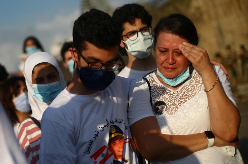 A woman reacts during a vigil for the victims lost in a massive explosion, in Beirut, Lebanon. Reuters