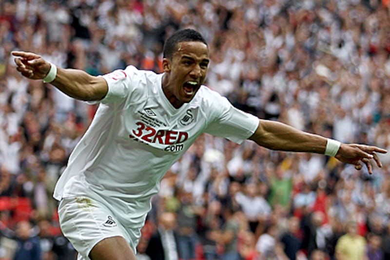 Scott Sinclair celebrates scoring his second goal against Reading in Swansea's 4-2 victory in the play-off final to reach the Premier League.