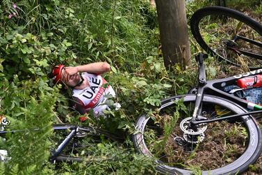 Cycling - Tour de France - Stage 1 - Brest to Landerneau - France - June 26, 2021 UAE Team Emirates rider Marc Hirschi of Switzerland reacts after a crash REUTERS/Anne-Christine Poujoulat