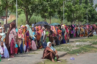 Voters queue up to cast their ballots at a polling station in the seventh and final phase of voting in India's general election, in Chandigarh on Saturday. AFP