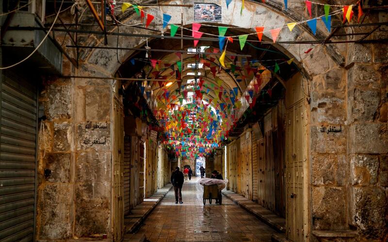 Closed shops in an alley in the city of Nablus in the occupied West Bank, as people go on strike protesting against the visit of US vice president Mike Pence to Israel and Jerusalem. Jaafar Ashtiyeh / AFP