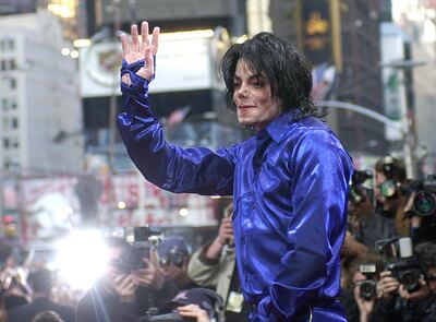 FILE - This Nov. 7, 2001 file photo, Michael Jackson waves to crowds gathered to see him at his first ever in-store appearance in New York. The producers of â€œThe Simpsonsâ€ are removing a classic episode that featured the voice of Michael Jackson. Executive producer James L. Brooks told The Wall Street Journal on Thursday, March 7, 2019,  â€œit feels clearly the only choice to make.â€ He said fellow executive producers Matt Groening and Al Jean are â€œof one mind on this.â€ (AP Photo/Suzanne Plunkett)