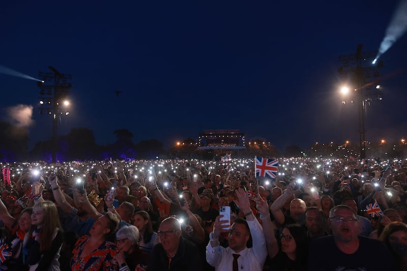 Out with the mobiles ... audience members at the Windsor Castle grounds. AFP