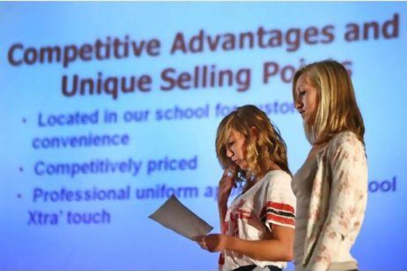 Maryke Blick and Abbie McMillan compete in the Tsu'Chu Biz competition on Wednesday at Al Ain English Speaking School.