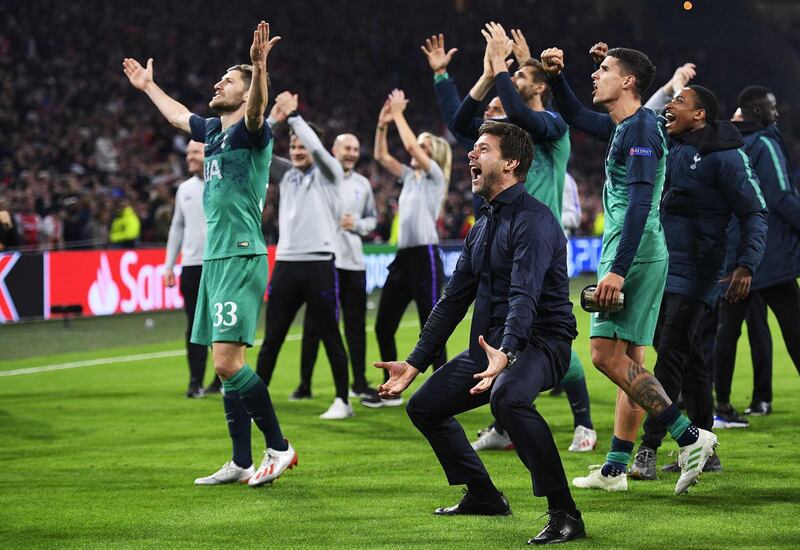 Mauricio Pochettino, front, and players of Tottenham Hotspur celebrate. EPA