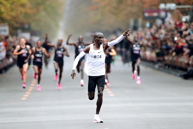 Kenya's Eliud Kipchoge, the marathon world record holder, crosses the finish line during his attempt to run a marathon in under two hours in Vienna, Austria. REUTERS