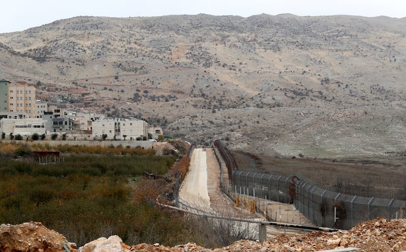 Israel's security fence with Syria next to the the village of Majdal Shams, in the Israeli-annexed Golan Heights, December 10, 2021. EPA
