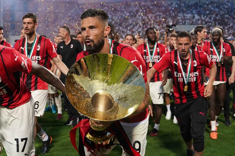 Olivier Giroud celebrates with the trophy after AC Milan won the Serie A title. AP