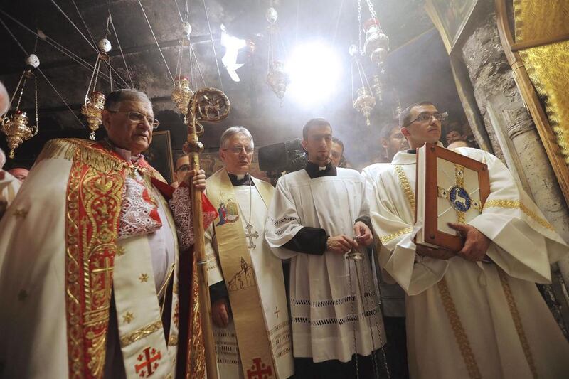 The Latin Patriarch of Jerusalem Fouad Twal leads a Christmas Midnight Mass at the Church of the Nativity in Bethlehem. Fadi Arouri / AP Photo