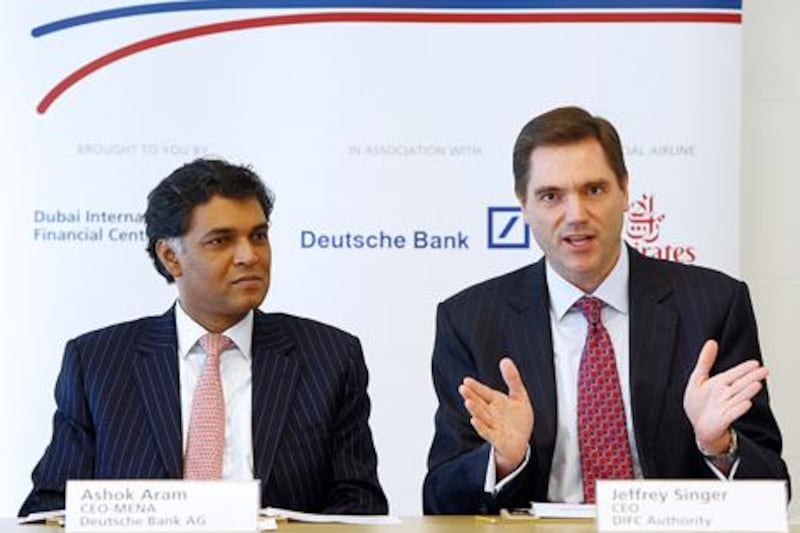 Dubai, United Arab Emirates-September 30, 2012;  (L)  Ashok Aram, CEO, MENA, Deutsche Bank and (R)  Jeffrey Singer, CEO,  DIFC Authority gestures during the press conference in Dubai  . (  Satish Kumar / The National ) For Business