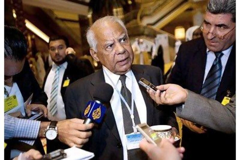 Hazem El-Beblawi, Egypt's minister of finance, is interviewed by members of the media after the extraordinary meeting of the Council of Arab Ministers of Finance hosted by Abu Dhabi at the Emirates Palace yesterday. Andrew Henderson / The National