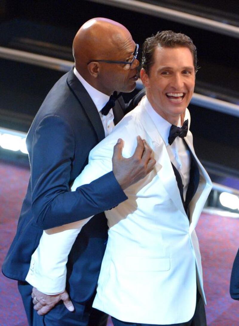 Samuel L Jackson, left, and Matthew McConaughey embrace in the audience. John Shearer / Invision / AP