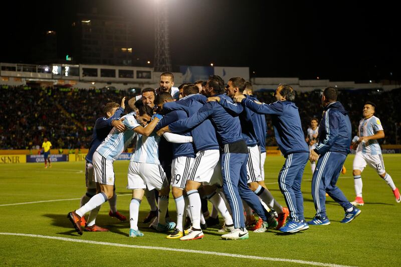 Argentina players celebrate after Lionel Messi scores his third goal against Ecuador during their 2018 World Cup qualifying  match at the Atahualpa Olympic Stadium in Quito. Fernando Vergara / AP Photo