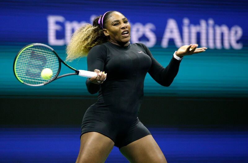 Serena Williams returns the ball against Maria Sharapova. AFP