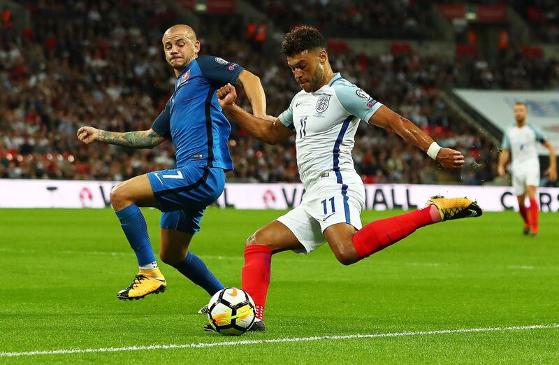 epa06183916 England's Alex Oxlade-Chamberlain (R) in action against Slovakia's Vladimir Weiss (L) during the FIFA World Cup 2018 qualifying Group F soccer match between England and Slovakia at Wembley in London, Britain, 04 September 2017.  EPA/NEIL HALL