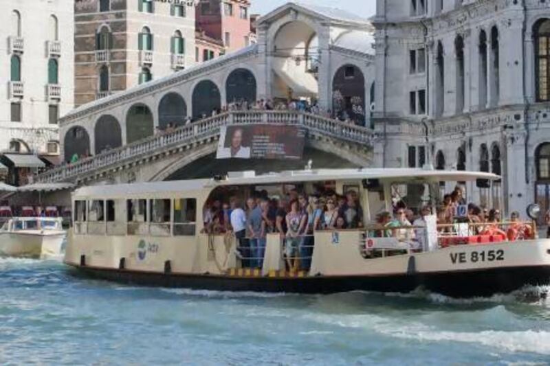 A crowded vaporetto sails near Rialto Bridge in Venice, Italy. Fare evasion costs ACTV, the company that runs the ferry service, about €1.5 million a year. Marco Secchi / Getty Images
